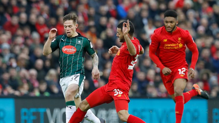 Liverpool's Kevin Stewart (right) and Plymouth Argyle's Craig Tanner battle for the ball during the Emirates FA Cup, Third Round match at Anfield, Liverpoo