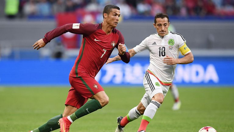 Portugal forward Cristiano Ronaldo (left) battles with Mexico's midfielder Andres Guardado