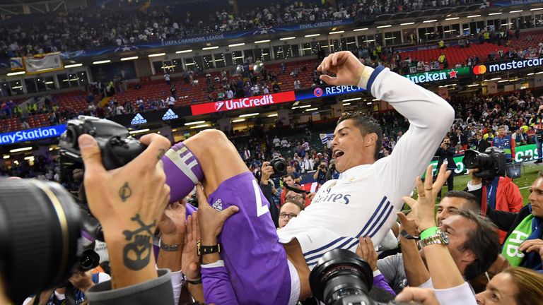  Cristiano Ronaldo is thrown into the air by his Real Madrid team mates after Champions League final victory