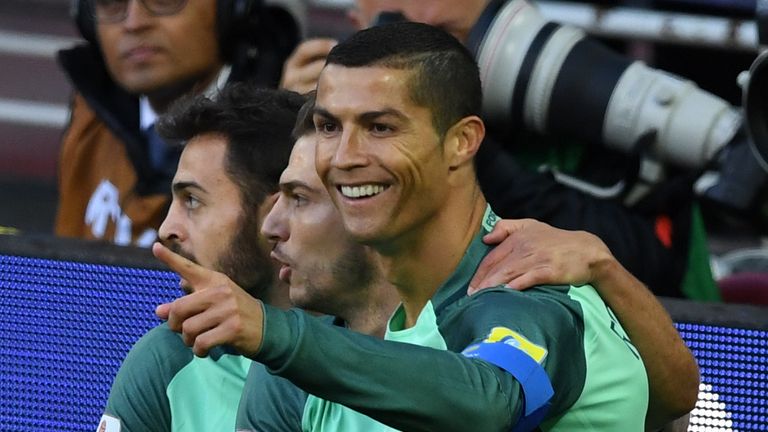 Portugal's forward Cristiano Ronaldo (R) celebrates after scoring a goal during the 2017 Confederations Cup group A football match between Russia and Portu