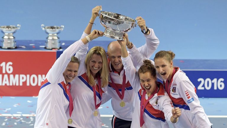 Czech Republic's players pose with the trophy at the end of the Fed Cup final between France and the Czech Republic in Strasbourg, eastern France, on Novem