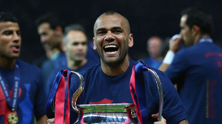 BERLIN, GERMANY - JUNE 06:  Daniel Alves of Barcelona celebrates with the trophy after the UEFA Champions League Final between Juventus and FC Barcelona at