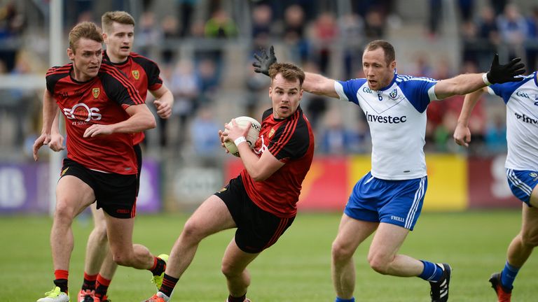 Darragh O'Hanlon of Down in action against Vinny Corey of Monaghan 