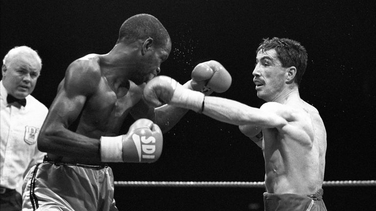 Challenger Dave McAuley (r) lands a left to the chin of champion Duke McKenzie (l)