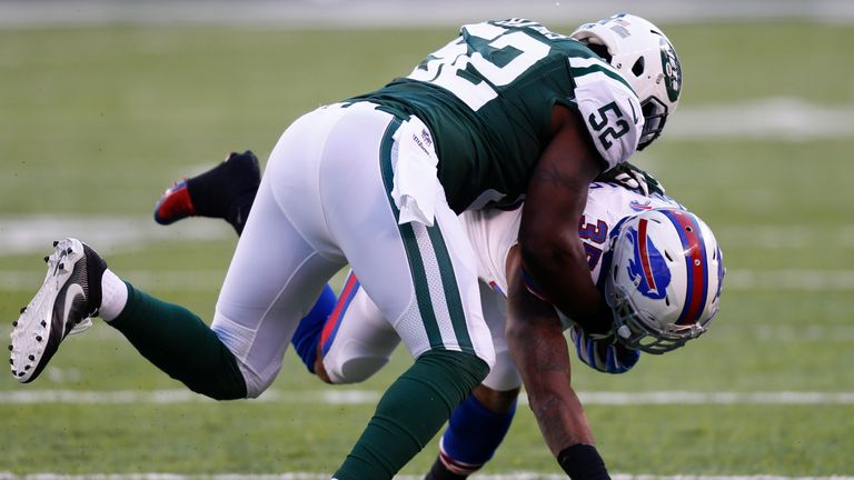 EAST RUTHERFORD, NJ - JANUARY 01:  David Harris #52 of the New York Jets tackles Mike Gillislee #35 of the Buffalo Bills at MetLife Stadium on January 1, 2