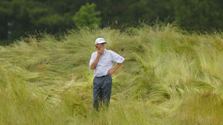 FARMINGDALE, NY - JUNE 15:  Davis Love the III searches for his ball in the deep grass on the 10th fairway during the third round of the 102nd US Open on t