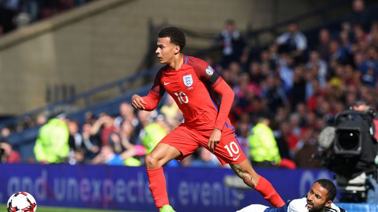 England's midfielder Dele Alli (L) vies with Scotland's midfielder Ikechi Anya during the group F World Cup qualifying football match between Scotland and 