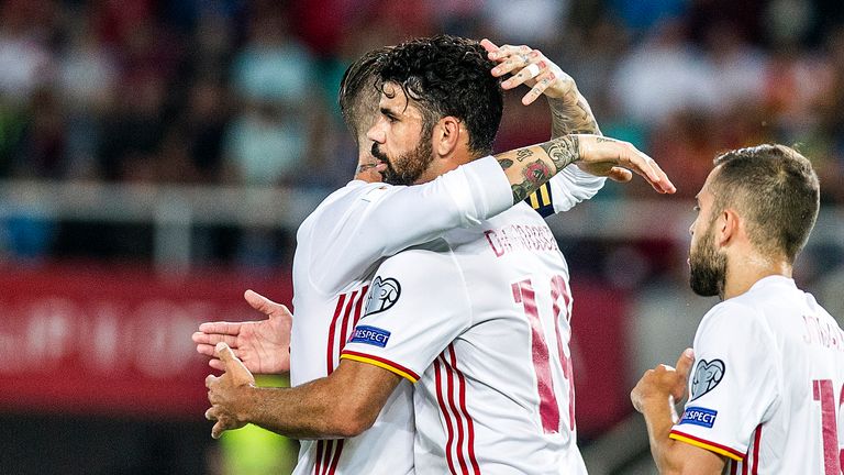 Spain's Diego Costa (2-L) celebrates with teammate Sergio Ramos (L) after scoring a goal during the FIFA World Cup 2018 qualification football match betwee
