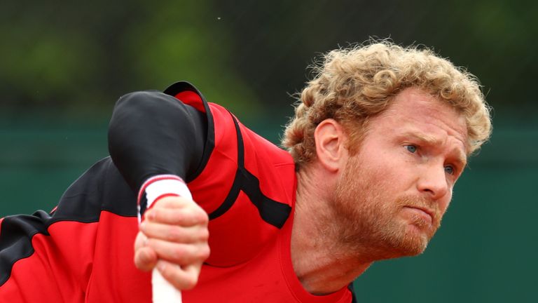 PARIS, FRANCE - MAY 24:  Dimitry Tursunov of Russia serves during the Men's Singles first round match against Roberto Bautistat Agut of Spain on day three 