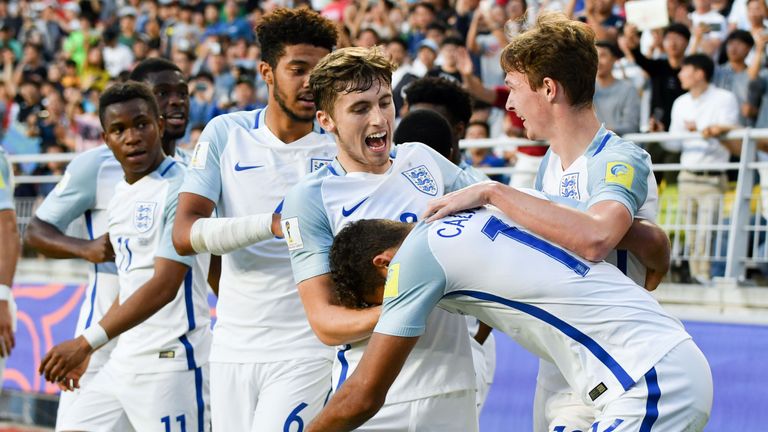 England's forward Dominic Calvert-Lewin (#16) celebrates his goal with teammates during the U-20 World Cup final football match between England and Venezu