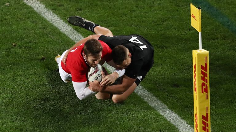Elliot Daly of the Lions is tackled short of the tryline by Israel Dagg of the All Blacks during the first test match bet