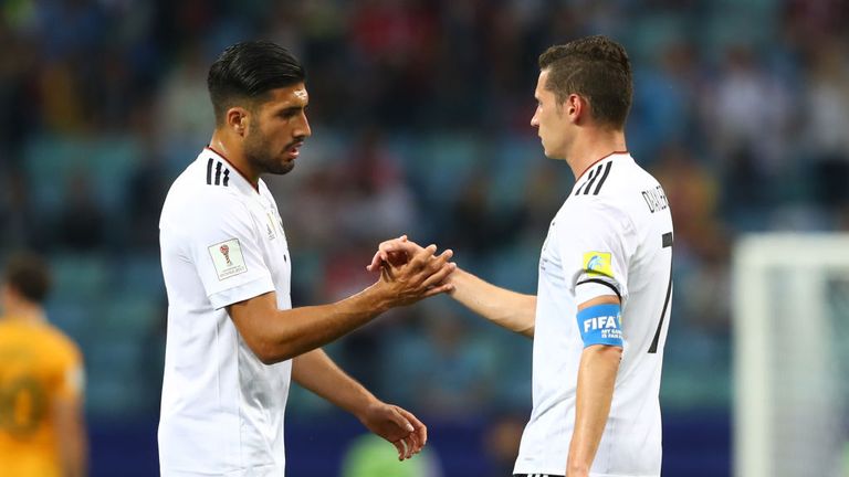 Emre Can of Germany and Julian Draxler of Germany shake hands