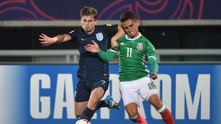 England Under-20s defender Jonjoe Kenny (L) and Mexico U20 midfielder Kevin Magana compete for the ball, U20 FIFA World Cup quarter-final