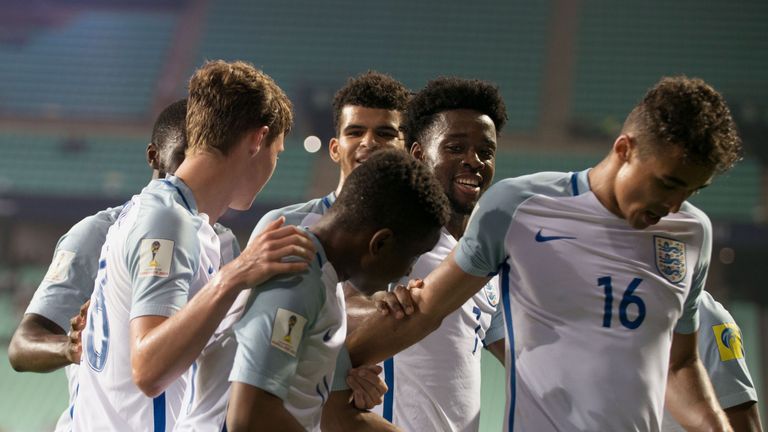 England's forward Ademola Lookman (front C) celebrates his goal with teammates during their U-20 World Cup round of 16 football match between England and C