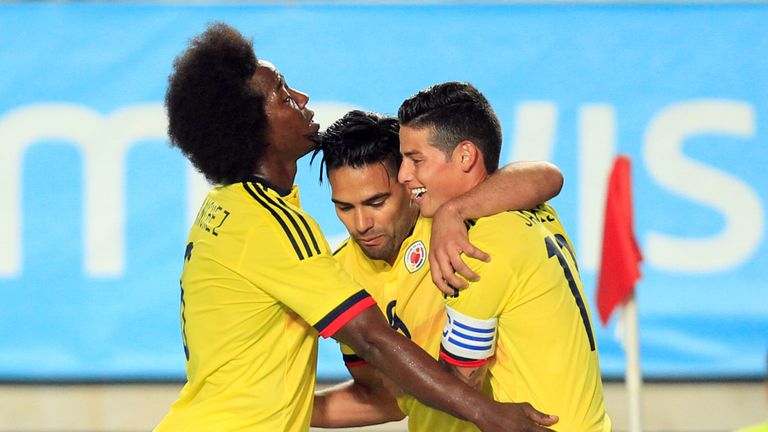 Colombia's forward Radamel Falcao (C) celebrates a goal with Colombia's midfielder James Rodriguez (R) and Colombia's midfielder Carlos Sanchez (L) during 