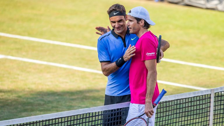 STUTTGART, GERMANY - JUNE 14: Roger Federer of Switzerland (L) congratulates Tommy Haas (R) of Germany after their round of sixteen match of Mercedes Cup 2