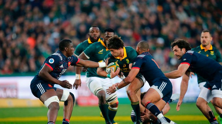 France try to stop South Africa's lock Franco Mostert making ground 