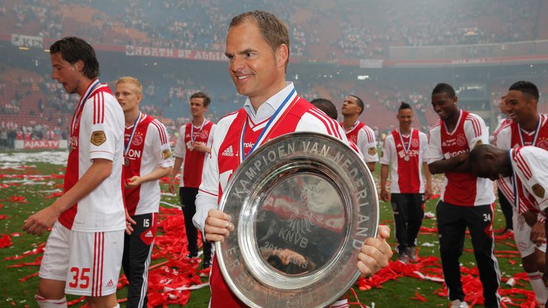 Frank de Boer poses with the Eredivisie trophy at Ajax