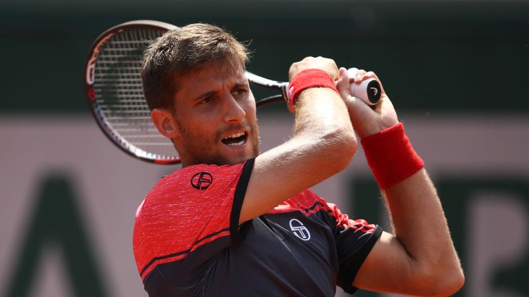 Martin Klizan of Slovakia hits a forehand during the men's singles second round match against Andy Murray of Great Britain