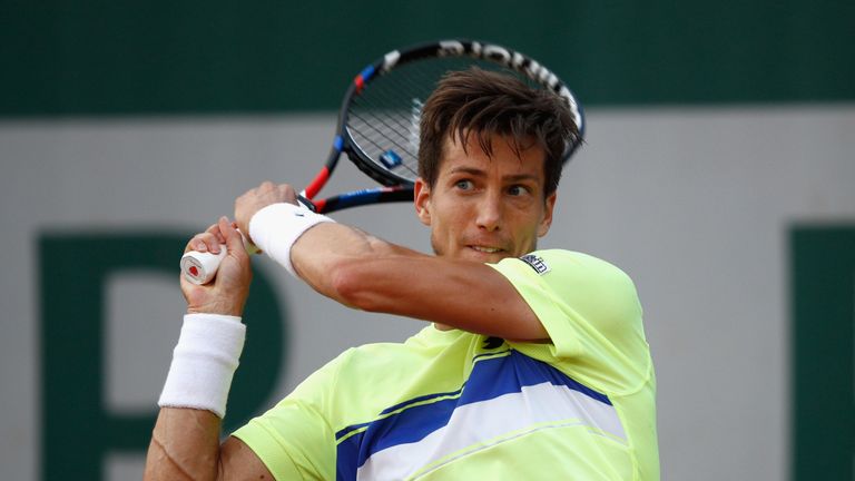 Aljaz Bedene of Great Britain plays a backhand during the mens singles second round match against Jiri Vesely of The Czech Republic