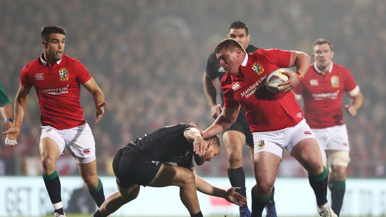 Tadhg Furlong of the Lions hands off Tawera Kerr-Barlow of the Maori All Blacks in the first half