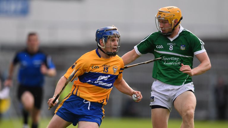 Podge Collins of Clare in action against Paul Browne of Limerick