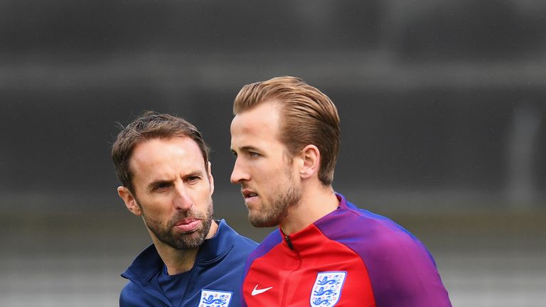 BURTON-UPON-TRENT, ENGLAND - JUNE 09:  Gareth Southgate manager of England and Harry Kane of England in discussion during an England training session on th
