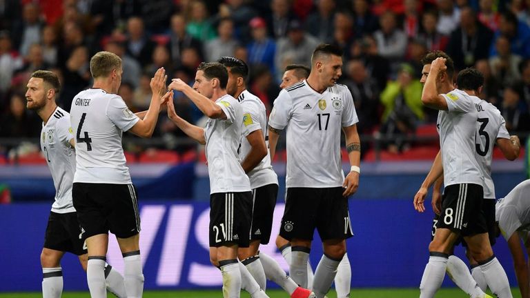 Germany's midfielder Lars Stindl (R) celebrates with teammates 