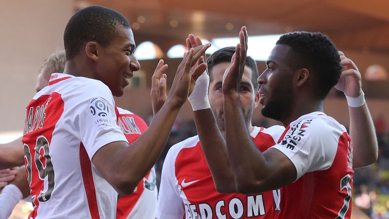 Monaco's French midfielder Thomas Lemar (R) celebrates after scoring a goal with Monaco's French forward Kylian Mbappe Lottin (L) during the French L1 foot