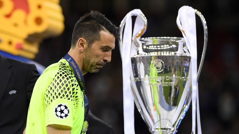 CARDIFF, WALES - JUNE 03:  Gianluigi Buffon of Juventus walks past the Champions League trophy after the UEFA Champions League Final between Juventus and R