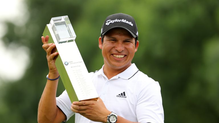 Andres Romero of Argentina poses with the trophy following his victory during the final round of the BMW International Open at 
