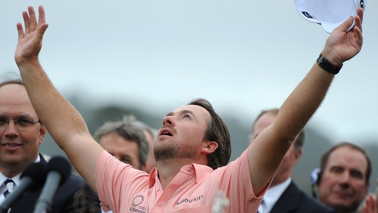 Northern Ireland's Graeme McDowell celebrates after winning the US Open Trophy at the 110th U.S. Open at Pebble Beach Golf Links at the US Open golf champi