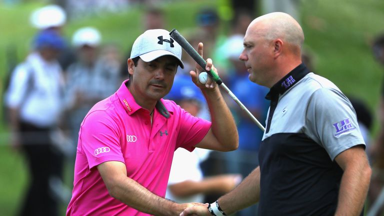 ATZENBRUGG, AUSTRIA - JUNE 10:  Felipe Aguilar of Chile shakes hands with Graeme Storm of England on the 18th green during the third roud of the Lyoness Op