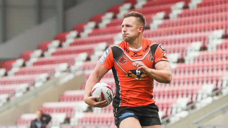 Greg Eden runs in another try for the Tigers