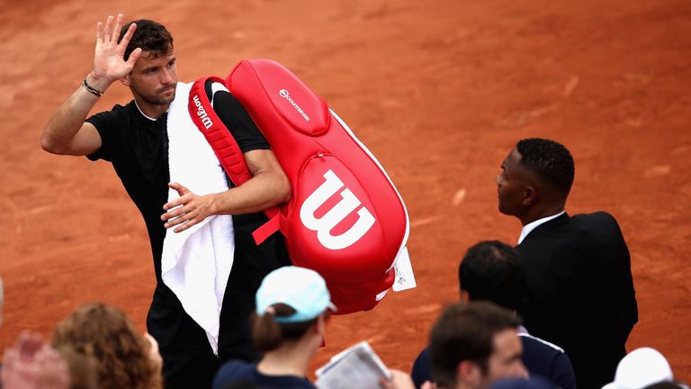 PARIS, FRANCE - JUNE 02:  Grigor Dimitrov of Bulgaria leaves the court following defat in the mens singles third round match against Pablo Carreno Busta on