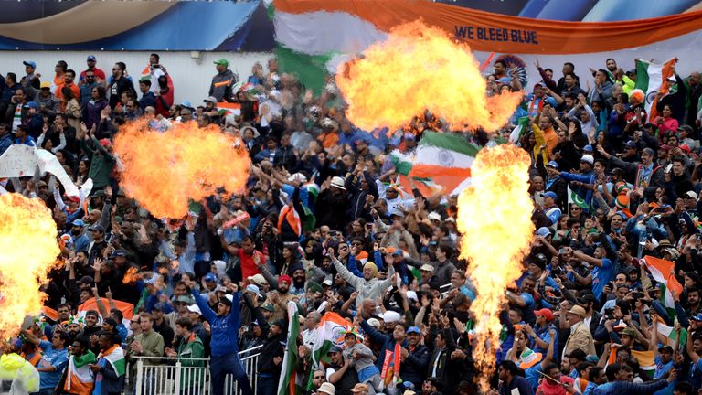 Indian cricket fans cheer during the ICC Champions Trophy match between India and Pakistan at Edgbaston on June 4, 2017