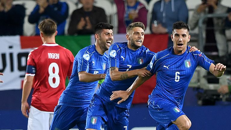 Lorenzo Pellegrini celebrates scoring the opening goal with his team-mates forward Domenico Berardi and midfielder Marco Benassi