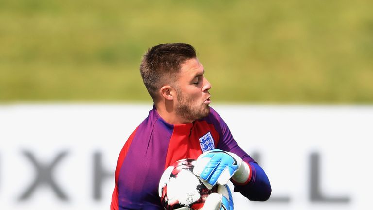 Goalkeeper Jack Butland of England catches the ball during an England training session on the eve of their World Cup Qualifier v Scotland