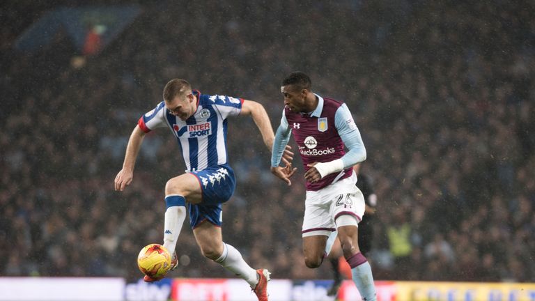 BIRMINGHAM, ENGLAND- DECEMBER 10:  Jake Buxton of Wigan and Jonathan Kodjia of of Aston Villa Athletic in action during the Sky Bet Championship match betw