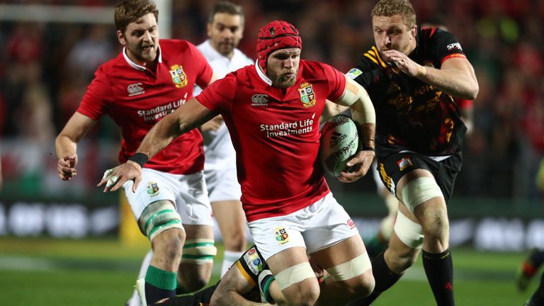 James Haskell of the Lions is tackled by Chiefs' Finlay Christie