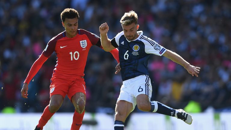 Dele Alli of England and James Morrison of Scotland compete for the ball during the FIFA 2018 World Cup Qualifier between Scotland and England