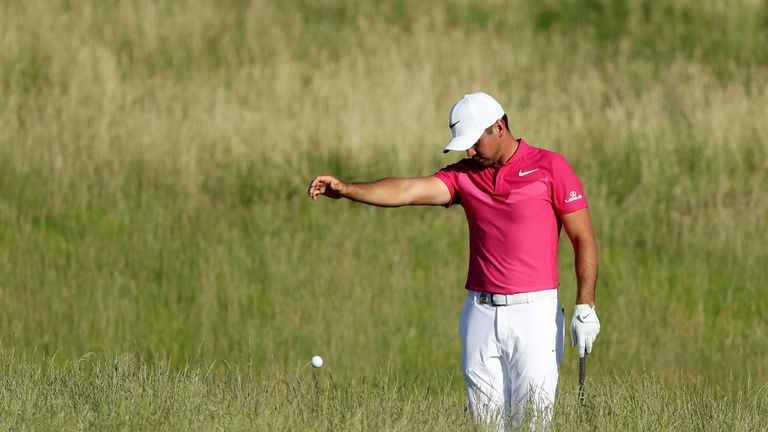 Jason Day of Australia finds his ball in the deep rough