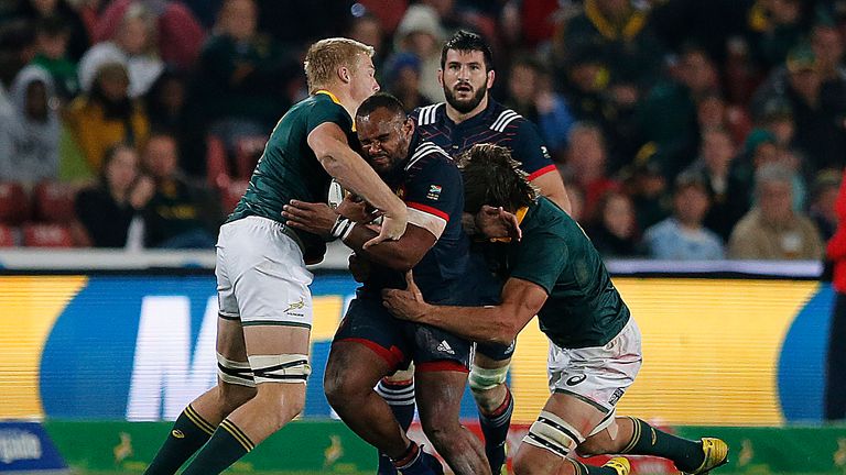 France loose head prop Jefferson Poirot (C) is tackled during their third rugby union Test match between South Africa and France at the Emirates Ellis park