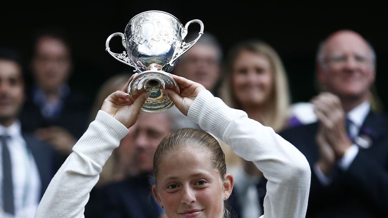 Latvia's Jelena Ostapenko holds her winner's trophy after beating Slovakia's Kristina Schmiedlova in their girls singles final match 