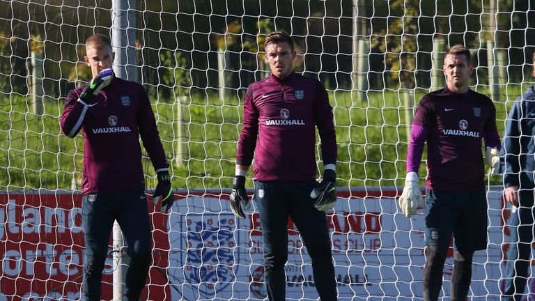 Joe Hart, Jack Butland and Tom Heaton of England look on during the England training session at St Georges Park o