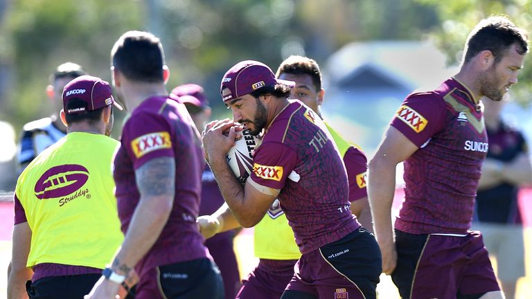 GOLD COAST, AUSTRALIA - JUNE 18: Johnathan Thurston takes on the defence during a Queensland Maroons training session at Sanctuary Cove Resort on June 18, 