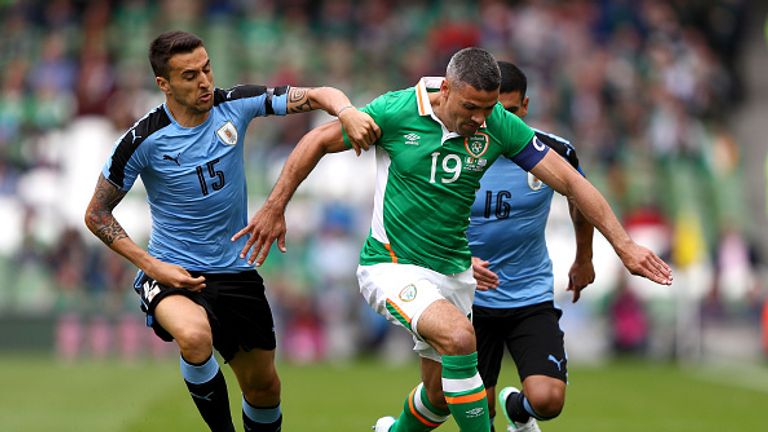 Jonathan Walters of the Republic of Ireland attempts to get past Matias Vecino of Uruguay during the international friendly in Dublin