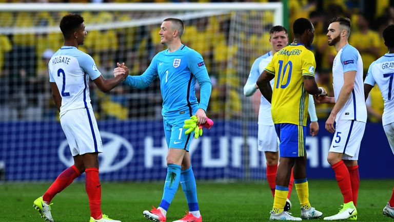 England's defender Mason Holgate (L) and goalkeeper Jordan Picford react after the UEFA U-21 European Championship Group A football match Sweden v England 