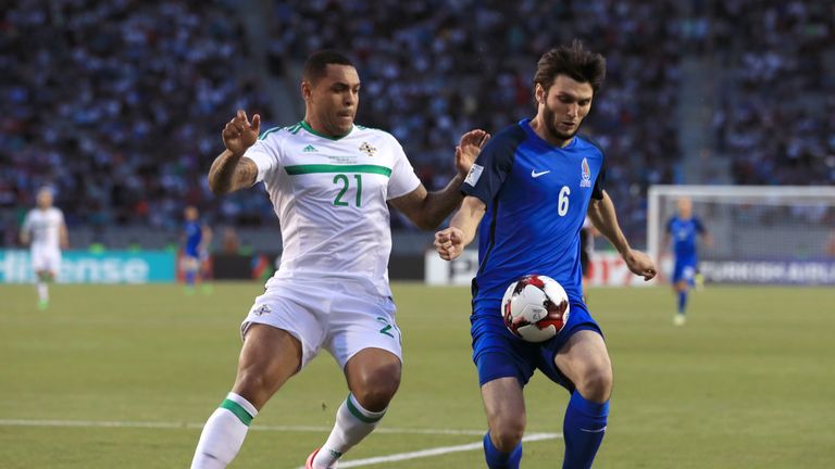 Northern Ireland's Josh Magennis (left) and Azerbaijan's Badavi Guseynov battle for the ball during the 2018 FIFA World Cup qualifying, Group C 