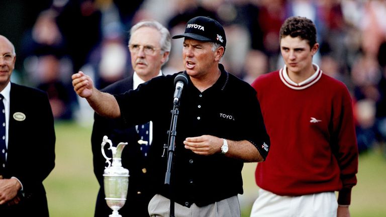 Mark O'Meara of the United States beside the Claret Jug after his win with Justin Rose of England behind who won the Silver Medal for the leading amateur